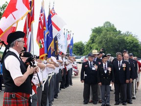 Piper Dick Laurie and colour parties from the Woodstock and Stratford Naval Veterans Associations prepare to lead Ojibwa submariners to their places of honour Saturday morning in Port Burwell. Jeff Tribe/Tillsonburg News
