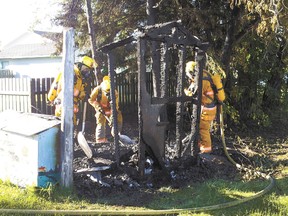 Mayerthorpe firefighters complete work on a extinguishing a fire that destroyed a small shed at 1422 - 47 Street on June 28.