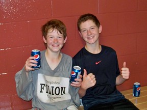 Riley Fitzgerald, at left, and his brother Sam, were all smiles after winning the peewee division final in the Cornwall Optimist Minor Ball Hockey League. The brothers patrolled the blueline for Filions Trophies.
Submitted photo