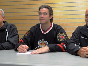 Sarnia Legionnaires head coach Dan Rose, right, and assistant Bob Farlow, left, announce the signing of of 17-year-old centre Riley Roberts Monday, July 8, 2013 at the RBC Centre in Sarnia, Ont. (PAUL OWEN, The Observer)