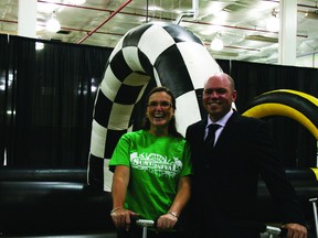 Mayor Melissa Blake and Joey Hundert of Sustainival pose after a scooter race at the announcement of the second-annual sustainability festival. ANDREW BATES