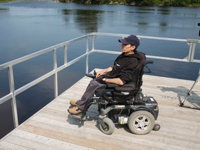Timmins resident John Bolduc takes in a view of the Mattagami River Monday morning where he usually enjoys kayaking. However, last week while going for an afternoon, he returned to the boat launch to find that his wheelchair had been stolen. Although the chair was eventually returned, the idea that it could happen again remains a nagging concern to him.