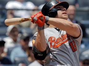 Baltimore Orioles batter Chris Davis hits a two-run home run against the New York Yankees during MLB action at Yankee Stadium in New York, July 6, 2013. (REUTERS/Ray Stubblebine)