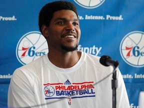 Newly acquired Philadelphia 76ers player Andrew Bynum smiles during a news conference at the National Constitution Center in Philadelphia, August 15, 2012. (REUTERS/Tim Shaffer)