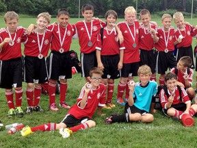 The Chatham Under-11 Attack celebrate winning silver medals at the St. Thomas soccer tournament Sunday. (Contributed Photo)