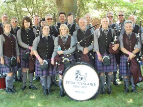 Thousands visited the 14th annual Kincardine Scottish Festival and Highland Games on July 5-7, 2013. Kincardine's own Penetangore Pipe Band take a break from practicing their music for the Pipe Band competition. The group went on to win first place for the Grade 3 division. (ALANNA RICE/KINCARDINE NEWS)