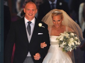Britain's Zara Phillips, the eldest granddaughter of Queen Elizabeth, and her husband England rugby captain Mike Tindall, leave the church after their marriage at Canongate Kirk in Edinburgh, Scotland, in this file photograph dated July 30, 2011. The Queen's granddaughter, Zara Phillips and her husband, rugby player, Mike Tindall are expecting their first baby in the New Year, Buckingham Palace said in a statement on July 8, 2013.