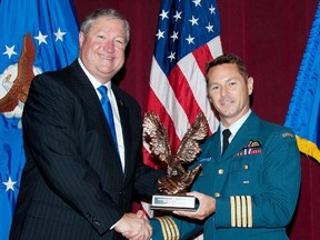 Col. David Lowthian, right, receives the 2012 Secretary of the Air Force Leadership Award from the Secretary of the US Air Force, Michael Donley at Maxwell Air Force Base in Montgomery in Alabama last year.