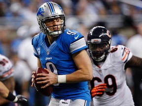 Detroit Lions quarterback Matthew Stafford looks for his receiver while being pressured by the Chicago Bears defence during the second half of their NFL football game in Detroit, Michigan December 30, 2012.  (REUTERS)