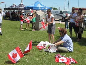 Sheena Read Editor
Chamber president Pam Woodall and chamber director Alex Bourdes set up Canada Day flags, whirlygigs and head gear to give out to the crowds.