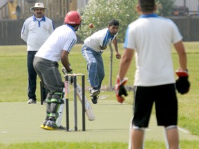 Diana Rinne/Daily Herald-Tribune
Sandeep Singh of the Warriors bowls to GP Dinosaurs batsman Waqar Khan under the watchful eye of umpire Digvijay Singh Parmar during Game 3 of the Grande Prairie Champions Trophy at the cricket pitch located at Northridge Park last Sunday. The Dinosaurs won the match and lead the 11-match series 2-1.