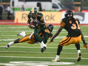 Hugh Charles carried the ball 11 times during Sunday's game against the Hamilton Tiger-Cats. (Dave Thomas, Edmonton Sun)