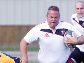 Perhaps the Bow Valley Grizzlie is thinking ‘if this doesn’t stop him nothing will’ as he tries to make a tackle on the Calgary Knights player, July 3, a game that BV won 21-13 at Mitford Park