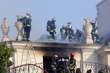 Firemen try to extinguish a fire at the 17th century Hotel Lambert in the Ile Saint Louis in Paris July 10,  2013.   REUTERS/Philippe Wojazer