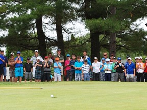 Cam Walters, 14, drains an eight-footer during a playoff against Jacob Udeschini, 16, to win the overall championship at the 8th annual Clarion Resort Pinewood Park Golf Course Junior Open, Monday. Below, the division winners, back row from left: Udeschini's 63 was tops among 14 juveniles 14 to 16 years old; Ryan Cunningham's 64 beat three other juniors 17 to 18; Walters, overall champion; front row from left, Nick Cundari's 66 was better than 39 bantam golfers 13 and under, and Brittany Stitt shot 108, lowest among four girls 14 and under. Right, Cole Harrington completes a post-game putting contest hole on the practice green.