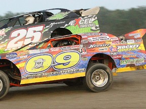 Frankford's Greg Belyea (25) had to hold off a heavy challenge from Trenton's Mat Vanderlinden (09) to win his first Pro Late Model feature of the season Saturday at Brighton Speedway.