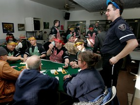 FILE PHOTO QMI Agency
In this photo from 2008, Northern Alberta Institute of Technology EMT students run a card game for the seniors at Operation Friendship Senior Society.  The EMT students were operating a fun casino in which the players could use their winnings for clothes, toques and other necessities. File photo/QMI Agency.