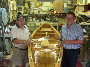 Jean Guy Gauthier, left and his son, Dan, proudly display their recently built homemade cedar canoe, inside Jean Guy’s garage in Cornwall.
Staff photo/GREG PEERENBOOM