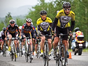 Chris Taylor of the Rundle Mountain Cycling Club leads the pack of Category 1 road racers up a climb just before the turnaround point in the Rundle Mountain Stage Race on Sunday, July 15, 2012. Justin Parsons/ Canmore Leader/ QMI Agency