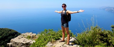 Edmonton Sun reporter Pamela Roth poses for a shot at a viewpoint along the Path of Gods hike in southwest Italy.