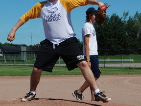 Jake Tougas throws a pitch at Veterans field recently while giving pointers to North Bay Bantam Stingers. Tougas, a West Ferris Secondary School and Stingers product, was a member of the Wilfred Laurier University baseball team last season.