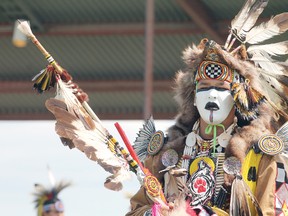Donny Mac of Onion Lake Cree Nation cuts a striking figure as he dances during the afternoon’s grand entry of the 2013 Ermineskin Powwow at Maskwacis Bear Park in Hobbema July 6.
