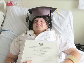 Picton teen Tailer Thompson proudly displays his Ontario Secondary School Diploma and graduation cap from his bed at Kingston General Hospital. Thompson is recuperating from injuries suffered in a single-vehicle accident on County Road 4 on May 29. PECI principal Darren McFarlane and vice-principal Paul Pickard visited Thompson last week to present him with the diploma.
Submitted photo