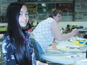 Ella Baisa and Dee Poisson. Ella is making a huge thank you poster for the people of Nanton