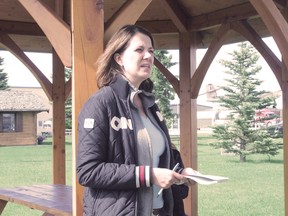 Danielle Smith, speaking to High River evacuees in Nanton in June