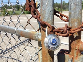 The locked gates to the tennis courts at West Hill in Owen Sound. (DENIS LANGLOIS/SUN TIMES)