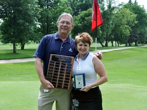 Lindsey Jordan poses with Dave Omichinski after she won the Portage Credit Union Ladies Open for the sixth time in ten years, Wednesday. Jordan took on Marni Zamzow in a playoff to be declared champ with a score of 83. (ROBIN DUDGEON/PORTAGE DAILY GRAPHIC/QMI AGENCY)