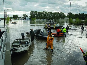 Strathcona County Emergency Services was joined in High River by representatives from the county's Utility and Transportation department to help manage the logistical aftermath following the flood. File Photo