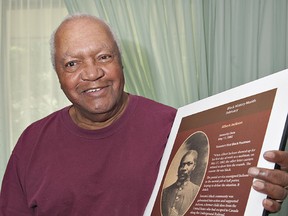 Lawrence Jackson of Brantford, Ontario holds a placard presented to him by the Canadian Union of Postal Workers, chronicling his grandfather, Albert Jackson, who became the first black postman in Toronto in 1882.  Prime Minister Sir John A. Macdonald intervened after postal workers refused to train Jackson because he was black.  A laneway in Toronto has recently been named after Jackson. (BRIAN THOMPSON Brantford Expositor)