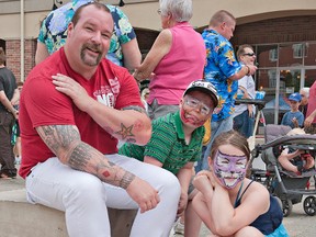 Following hot on the, ahem, heels of the 3rd annual Men In Heels event held June 22, Harmony Square in downtown Brantford continues to be the epicentre of city summer events in 2013. Pictured at the Men In Heels event is Paul Maher with his seven-year-old son Jacob and 10-year-old daughter Bethany. (BRIAN THOMPSON Brantford Expositor)