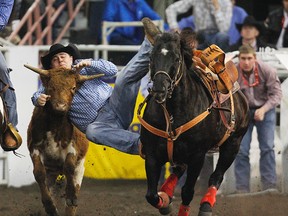 Zane Hankel wrestles a steer during the Canadian Finals Rodeo at Rexall Place in Edmonton, Alberta on Thursday, November 8, 2012. (PERRY NELSON/QMI Agency)