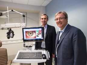 Dr. Martin ten Hove, left, head of Hotel Dieu Hospital's Ophthalmology department, and Dr. David Pichora, the hospital's CEO, show off some of the new equipment included in the department's $900,000 expansion.