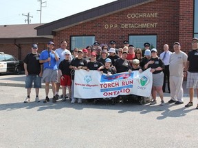Cochrane OPP officers and the Community Living residents walked through downtown Cochrane on July 4 with the “Flame of Hope” to raise awareness and money for the Special Olympics Ontario charity.