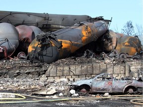 This photo, provided July 8, 2013, by Surete du Quebec, shows wrecked oil tankers and debris from a runaway train that derailed and exploded in Lac-Megantic, Quebec. (AFP PHOTO/ HO / Surete du Quebec)