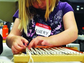 Avery works on weaving, Wednesday, during the Pottery a Fibre Arts Camp held at the Portage and District Arts Centre, July 8-12. Another camp is planned for July 22-26. (Robin Dudgeon/Potage Daily Graphic)