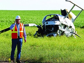 A helicopter went down near Gibbons on Friday, July 5 after getting caught up in power lines. The subsequent crash resulted in two men being taken to hospital — one by STARS Air Ambulance and one by ground ambulance. Photo by David Bloom.