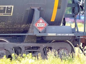 A rail car labelled Liquefied Petroleum Gas is shown in a railyard