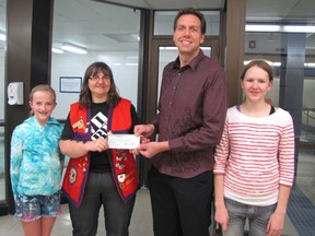 Receiving the cheque from Lion’s member Pat Calyniuk is Jason King, Vermilion Vipers club president, along with swimmers Sydney Joa and Jennifer Peterson.