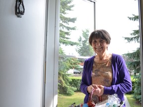 Wendy Knopke of the Stony Plain Welcome Wagon brings a basket of gifts for newcomers. - Thomas Miller, Reporter/Examiner