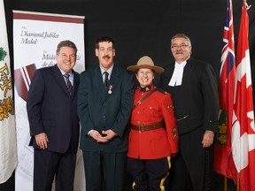 The extraordinarily dedicated Andrew Kojelis, second from left, here with MP Phil McColeman, RCMP Sgt. Paulette Breau and MPP Dave Levac, received a Diamond Jubilee medal at a Sanderson Centre ceremony last October.