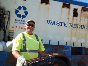 Municipal Waste and Recycling driver and collector Robert Major sorts recycled goods in Plummer Additional.