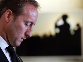 Defence Minister Peter MacKay speaks to the media as he unveils the Afghanistan Memorial Vigil on Parliament Hill on Tuesday in Ottawa.