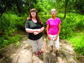 Deborah Kirkland, left, and Willie Smithwick stand at the site of a new telecommunications tower that is being planned near their homes just outside of Brockville. Kirkland and Smithwick have been fighting to have the tower moved somewhere else and have started a petition (THOMAS LEE/The Recorder and Times).