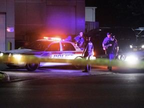 Police work in the  Terrace Banquet Hall parking lot after a double murder there. (VICTOR BIRO, Special to the Toronto Sun)