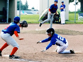 Part of the learning curve for the peewee Royals is learning about pick-off moves. Here, a runner was caught cold off first but an error on the play allowed him to advance to third base during action in Stony Plain. - Gord Montgomery, Reporter/Examiner