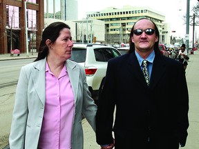 Denise Margaret Scriven and her husband Michael Lee Scriven walk away from the downtown courthouse in Edmonton, Alberta on March 1, 2013.  The Scrivens had plead out on charges of manslaughter. assault,Unlawful confinement, and failing to preserve the necessities of life for Denise's sister Betty Anne Gagnon.  

File Photo